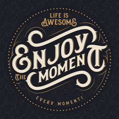Motivational quote lettering composition with text "Enjoy the moment"