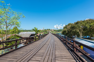 Fototapeta na wymiar Wooden bridge over the river (Mon Bridge) in Sangkhlaburi District, Kanchanaburi, Thailand.