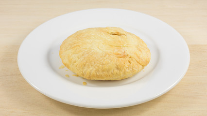 The Taiwanese sun cake (milk butter pastry) on the white plate.