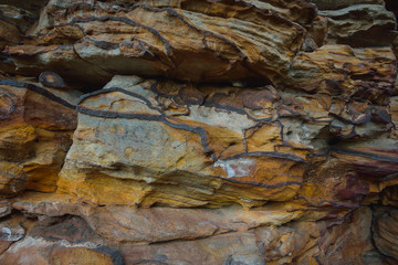 Natural colorful rock background, closeup texture