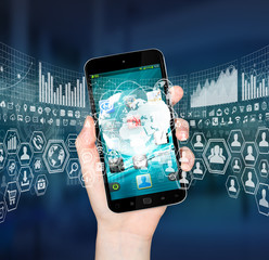Obraz premium Businesswoman using digital mobile phone charts interface