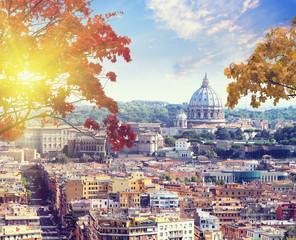 Obraz premium St. Peter's cathedral in Rome, Italy at sunset in autumn time. Counter light shot . Vintage colored picture. Love and travel concept