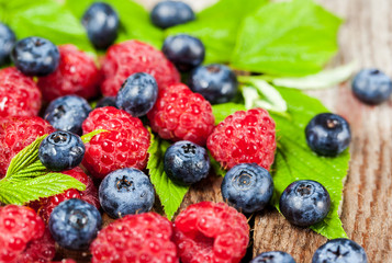Fresh organic ripe raspberry and blueberry