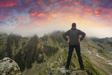 Hiker stays on a rocky ridge