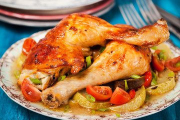 Roasted chicken legs with vegetables