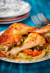 Roasted chicken legs with vegetables