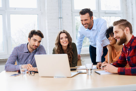 Teacher working with students in classroom