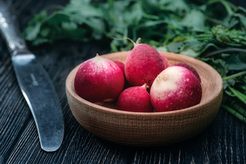 Radishes in a plate with a mystic light