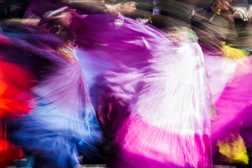 Blurred American tribal style dancers