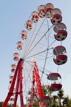 Ferris wheel on blue sky background
