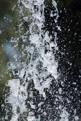 water drops in the air. Blurred soft abstract background. drop fountain.