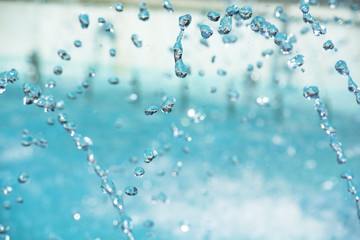 water drops in the air. Blurred soft abstract background. drop fountain.