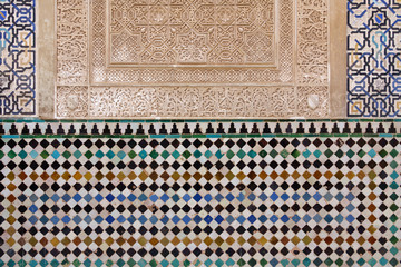 Decorated tiles with geometric shapes in colors in the Alhambra