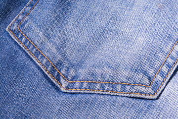 Jeans texture. Denim. The seam on the fabric.