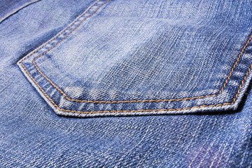 Jeans texture. Denim. The seam on the fabric.