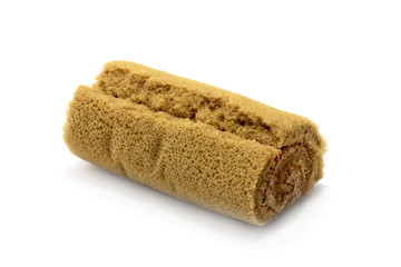 Cake roll coffee flavoured isolated on white background closeup