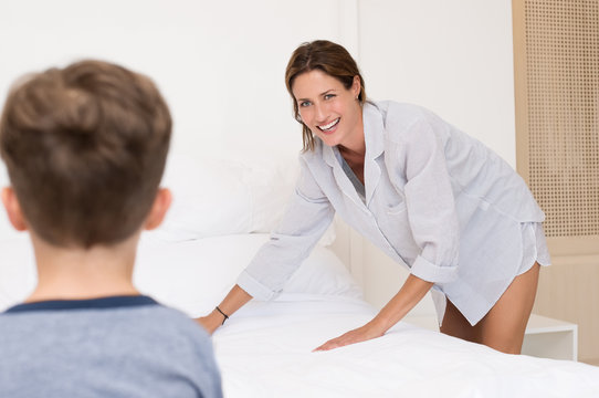 Mother Arranging Bed