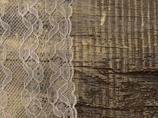delicate lace on the wooden background