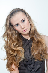 Naklejka premium portrait of a woman with long hair. A woman can be very different , it emits a lot of different emotions .