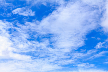 Blue sky background with white clouds. The vast blue sky and clouds sky on sunny day. White fluffy clouds in the blue sky.