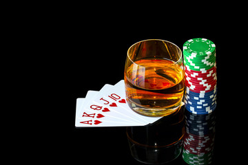 Cards with chips to play poker and tumbler whiskey - Powered by Adobe