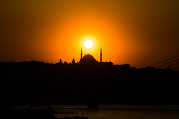 sunset and silhouette of a mosque in Istanbul
