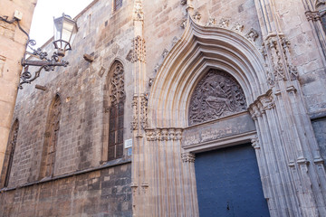 Fototapeta na wymiar Side door of the Cathedral of the Holy Cross and Saint Eulalia in Barcelona, Catalonia, Spain