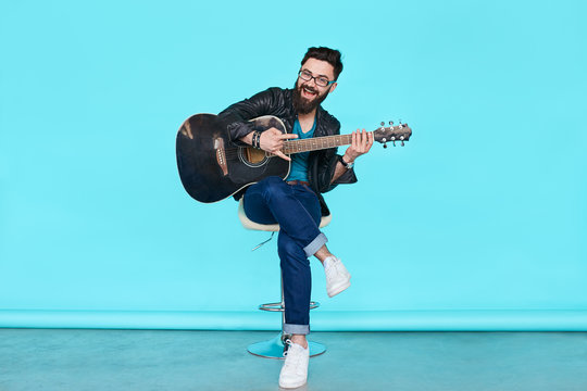 Handsome Musician Playing Guitar