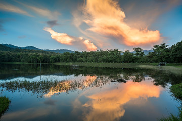 Fototapeta na wymiar The Reservoir in twilight with reflection at Jedkod Pongkonsao Natural Study and Ecotourism Center, Saraburi, Thailand