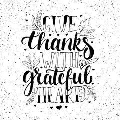 Give thanks with a greatful heart - Thanksgiving day lettering calligraphy phrase with leaves and hearts. Autumn greeting card isolated on the white background.