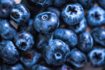 Blueberries on wooden background, macro close up