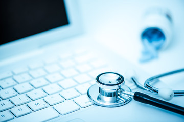 medical stetoscope on keyboard
