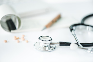 writing prescription on desk