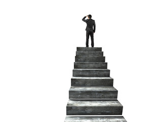 Businessman gazing on top of concrete stairs