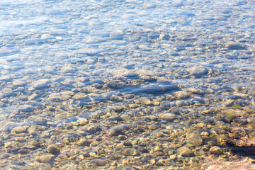 stones under the surface of the water