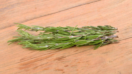 Fresh rosemary on the old wooden table