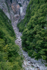 Fototapeta na wymiar Boka waterfall surrounded by forest in Triglav National Park, Sl