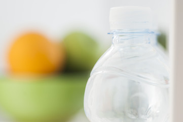 Bottles with water in refrigerator