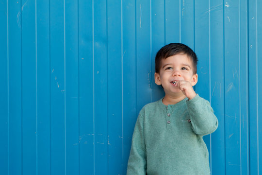 Happy Kid Eating A Lollipop