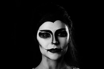 Halloween face-art girl with 
yellow eyes  