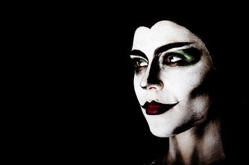 Halloween face-art girl with 
yellow eyes  