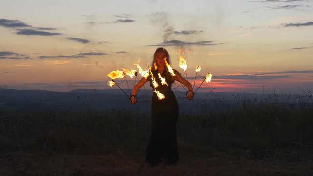Blonde haired female fire dancer