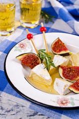 Pieces of Camembert and figs