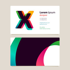 Business card template design with overlay X logo.