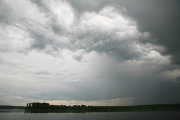 dramatic clouds over the river