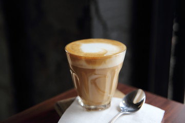 cappuccino coffee on wood background