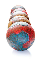 Row of Dirty Handball Balls Isolated on White