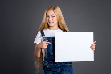 Girl showing white blank poster 