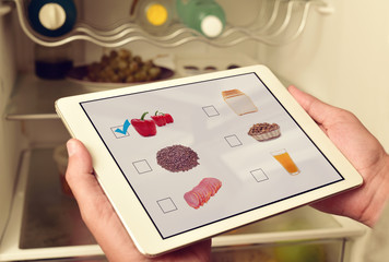young man making his shopping list