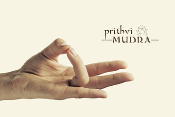 Image of woman hand in Prithvi mudra. Gesture is  isolated on toned background. - obrazy, fototapety, plakaty
